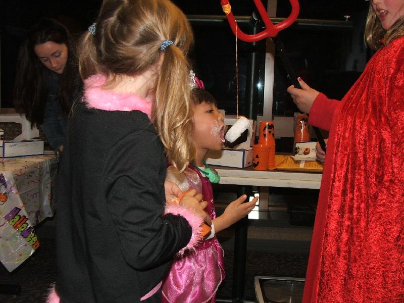 abbott 2006 kid halloween party - chu chu eating donut on string 